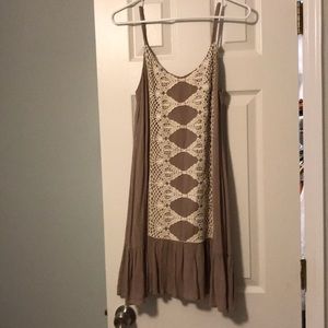 Dress with lace detail and ruffled hem.